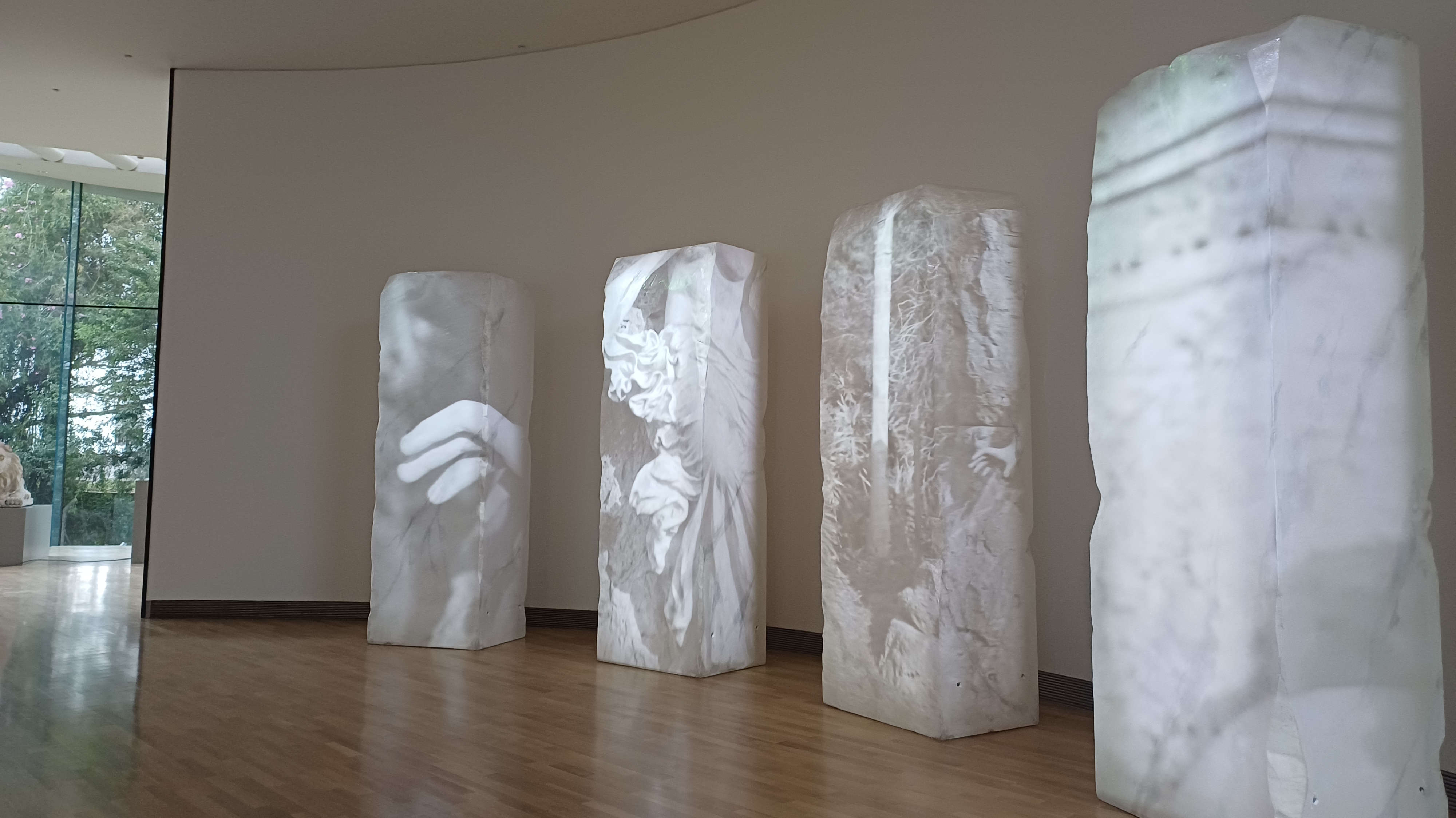 A projection mapping display on these theatrical marble blocks showcases the life and work of Lola Mora.